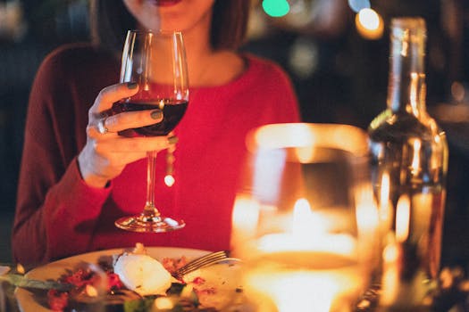 a bottle of red wine on a table