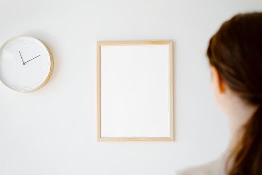 Person looking at a clock while thinking about fasting